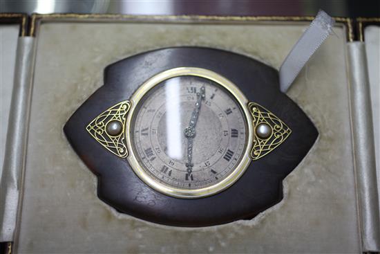 An early 20th century Art Nouveau white enamel inlaid tortoiseshell strutt clock, 11.2cm.